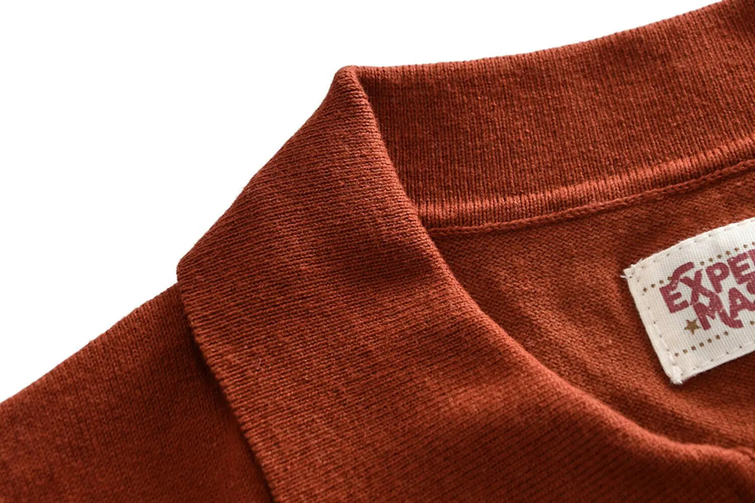 a close up of a red jacket on a red shirt 